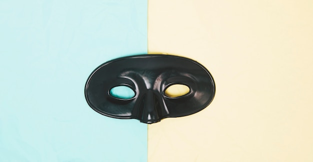 Black eye mask on dual background