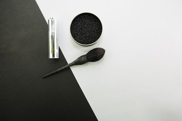 Black eyeshadow and brush