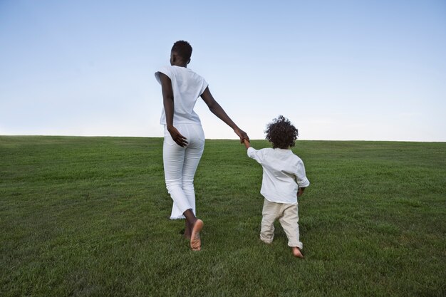 Black family enjoying time in natural location