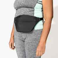 Free photo black fanny bag on active woman's hip