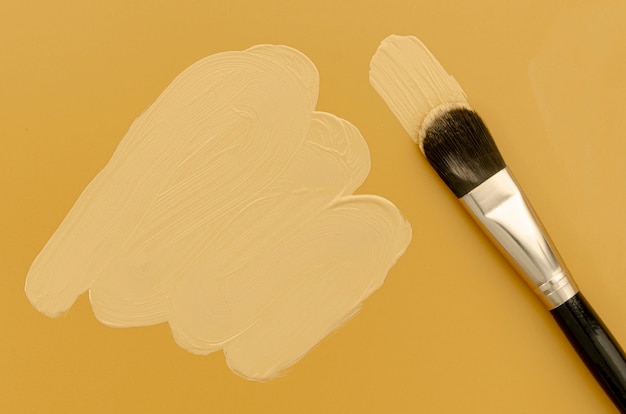 Black foundation brush on brown background