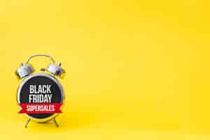 Free photo black friday alarm on yellow background