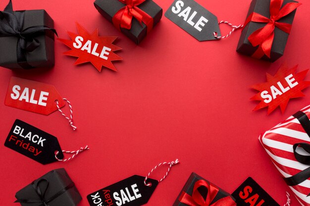 Black friday arrangement on red background with copy space