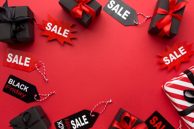 Black friday arrangement on red background with copy space