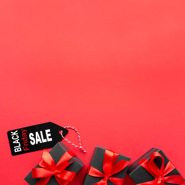 Black friday assortment on red background with copy space