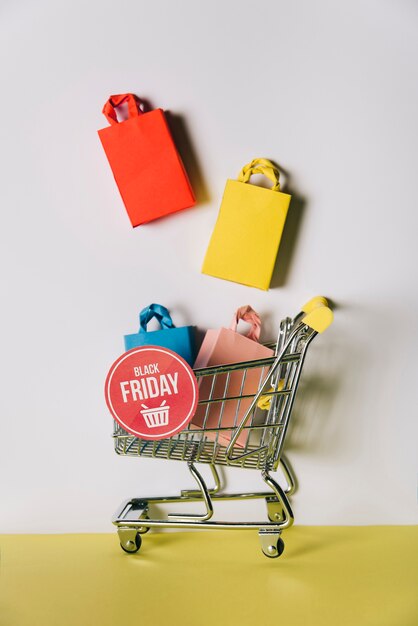 Black friday composition of bags in shopping cart