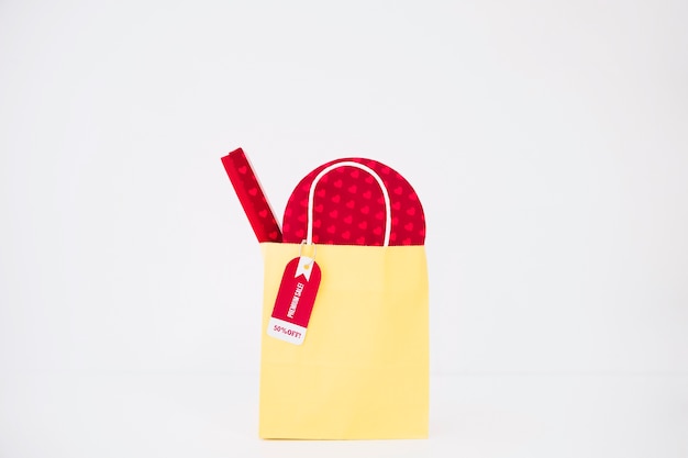 Black friday composition with yellow shopping bag