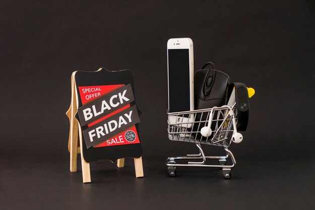 Black friday concept with board and smartphone