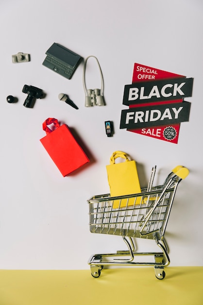 Black friday concept with products falling into cart
