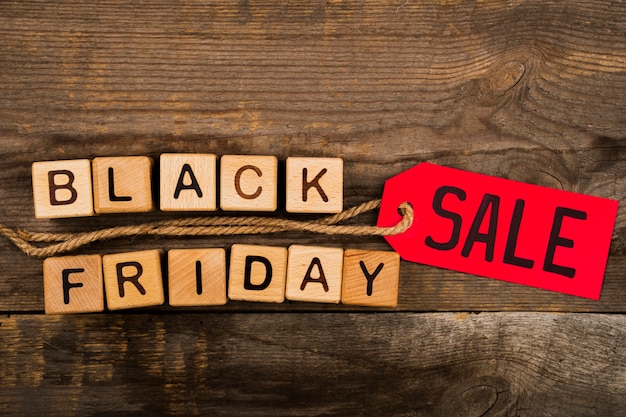 Black friday cubes and label on wooden background