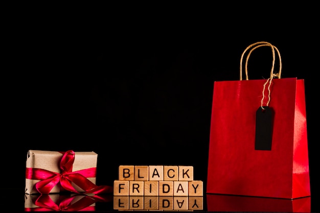 Free photo black friday cubes with present and bag