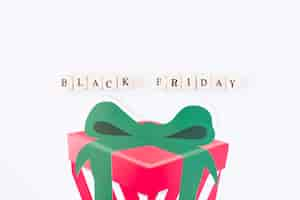 Free photo black friday inscription on cubes with paper gift box