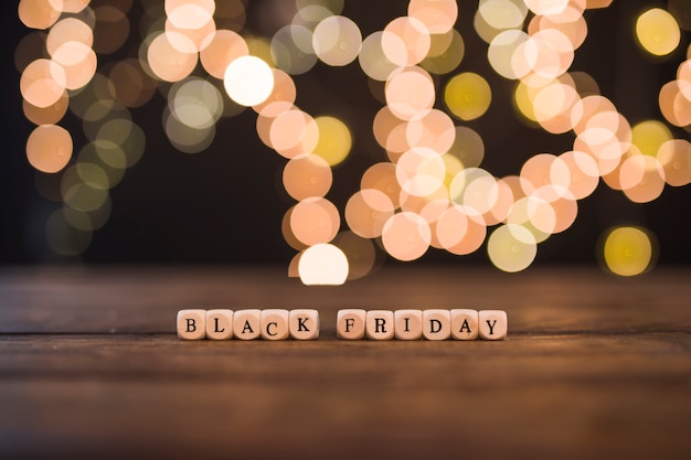 Black Friday inscription on small cubes with bokeh