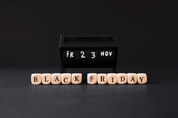 Free photo black friday inscription on white cubes