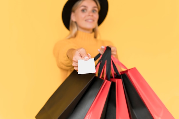 Black friday sale concept blurred woman with bags