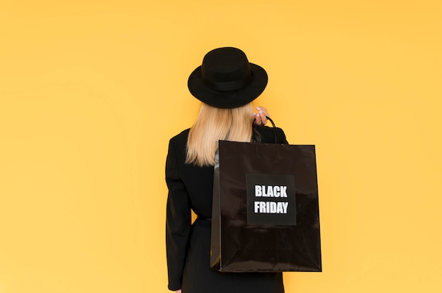 Free photo black friday sale concept woman from behind shot