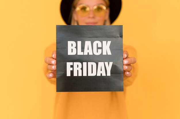 black friday sale concept woman holding label