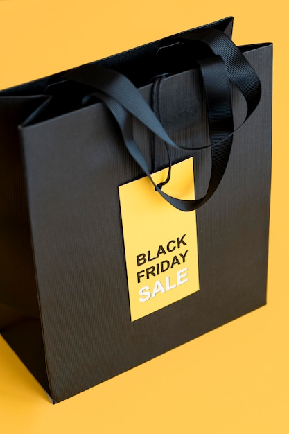 Free photo black friday sale label and shopping bag high view