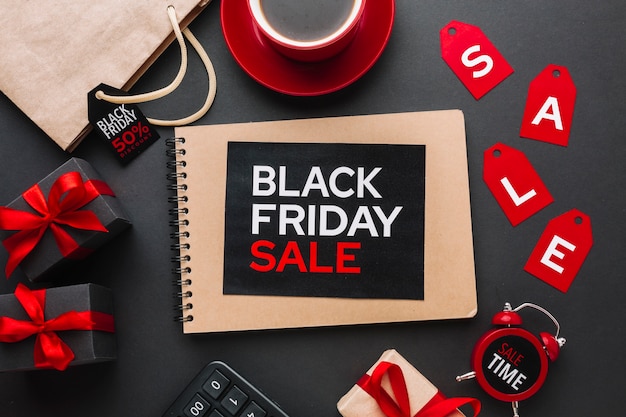 BFCM sale notebook on black background in preparation for e-commerce listings