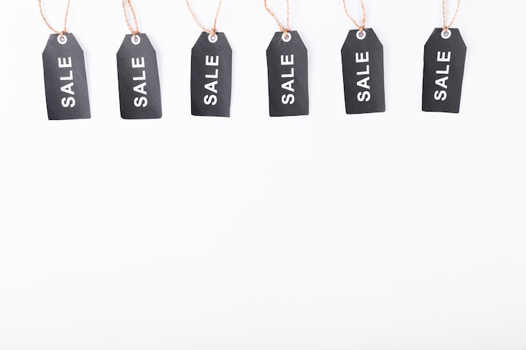 Free Photo black friday sale tags hanging from above