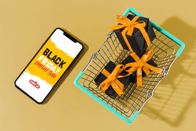 Black friday sales arrangement with shopping cart and smartphone