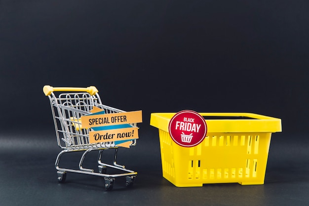 Black friday sales composition with cart and basket