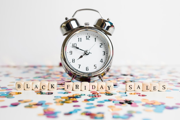 Black Friday sales inscription on white cubes with clock