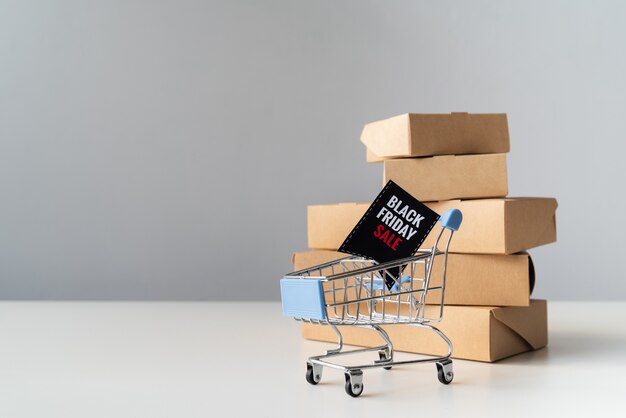 Black friday shopping cart in front of boxes