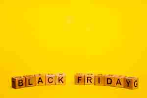 Free photo black friday word on yellow background with copy space