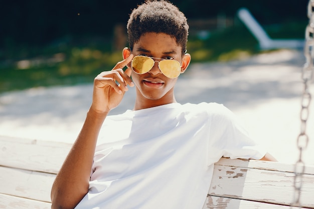 Free photo black guy in a summer park