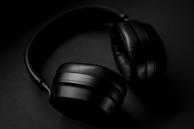 Black headphones on black textile