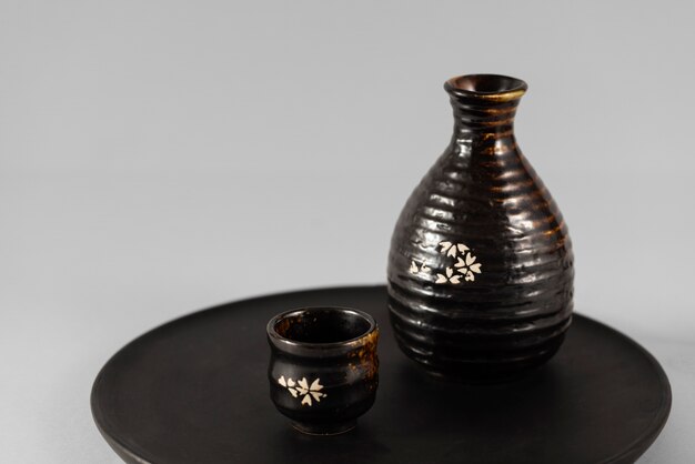Black japanese cup and bottle arrangement