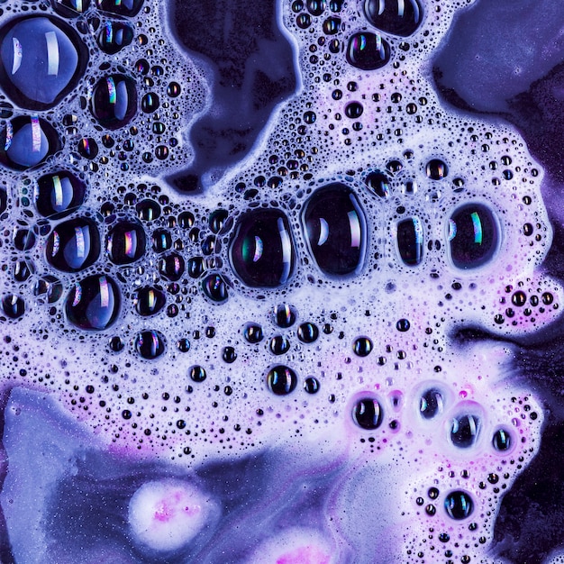 Black liquid with foam and blobs