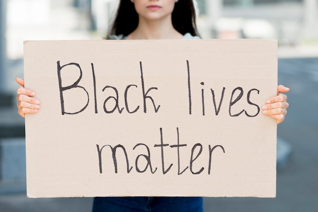 Black lives matter written on cardboard