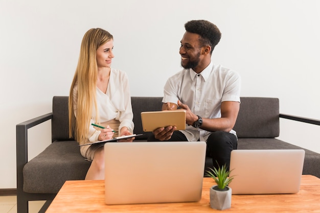 Black man explaining data to colleague