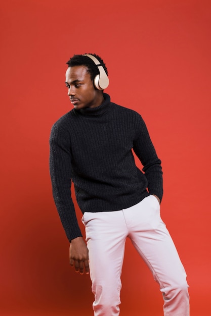 Black man posing with headphones