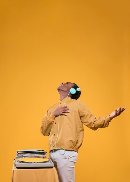 black man posing with headphones