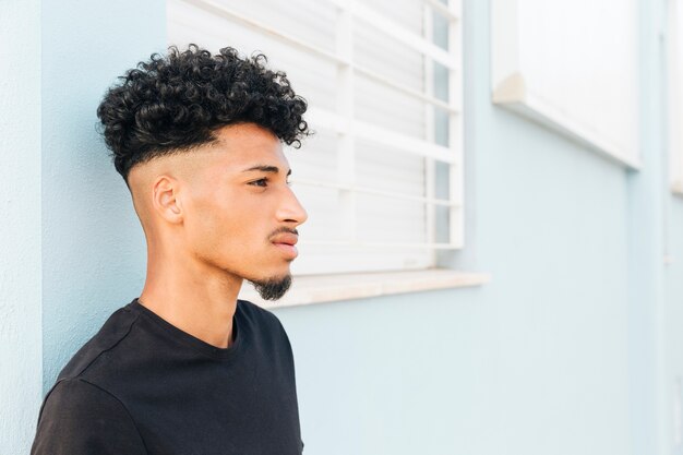 Black man with beard looking away