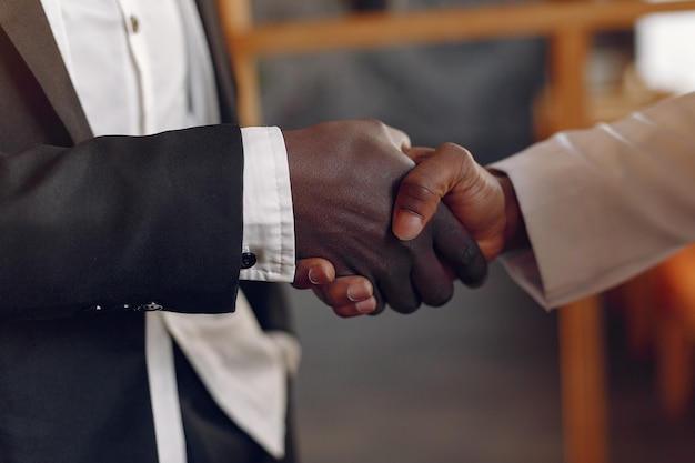 Black men in a cafe having a business