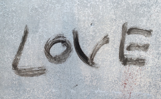 Free photo black message of love on metal texture