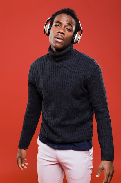 Black model posing with headphones