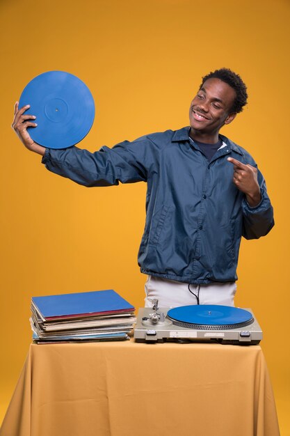 Black model posing with vinyls