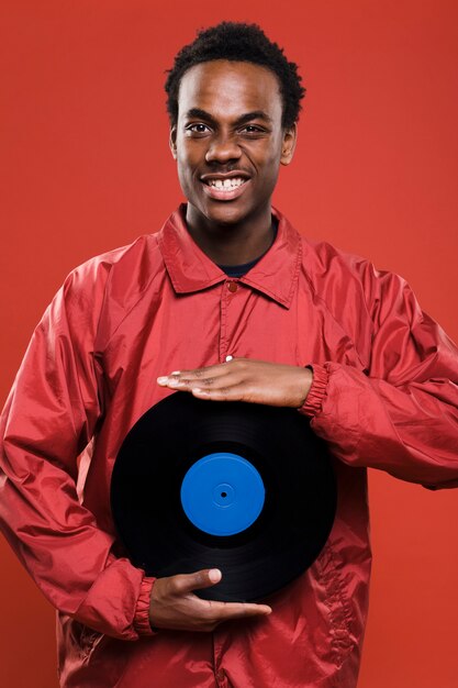 Black model posing with vinyls