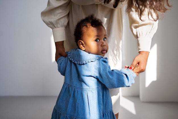 Black mother taking car of her child