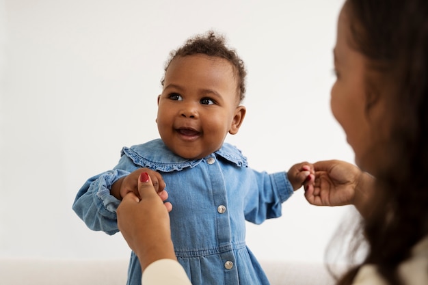 Black mother taking car of her child