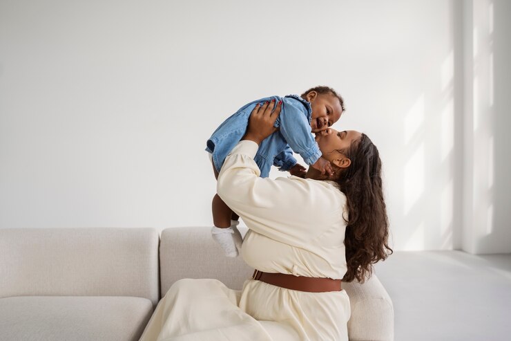 Free Photo black mother taking car of her child