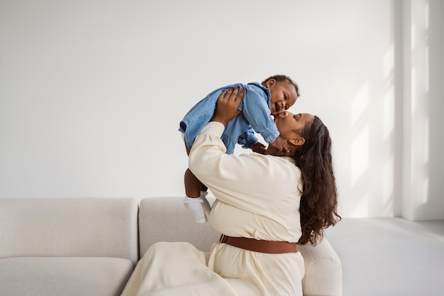 Black mother taking car of her child