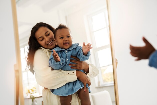 Black mother taking car of her child