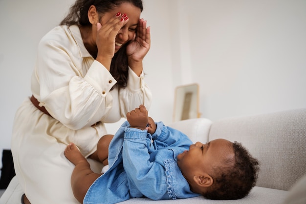 Free photo black mother taking car of her child