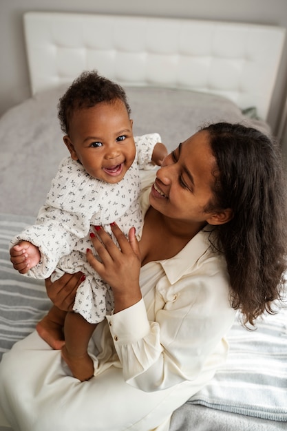 Free photo black mother taking car of her child